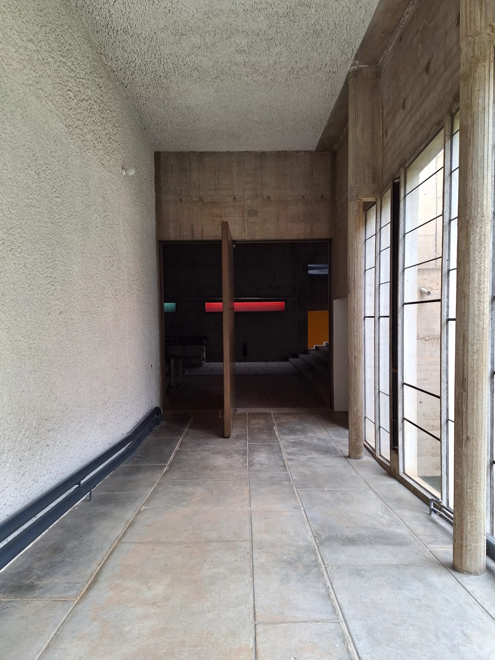 The passage to the church, with a wooden cross