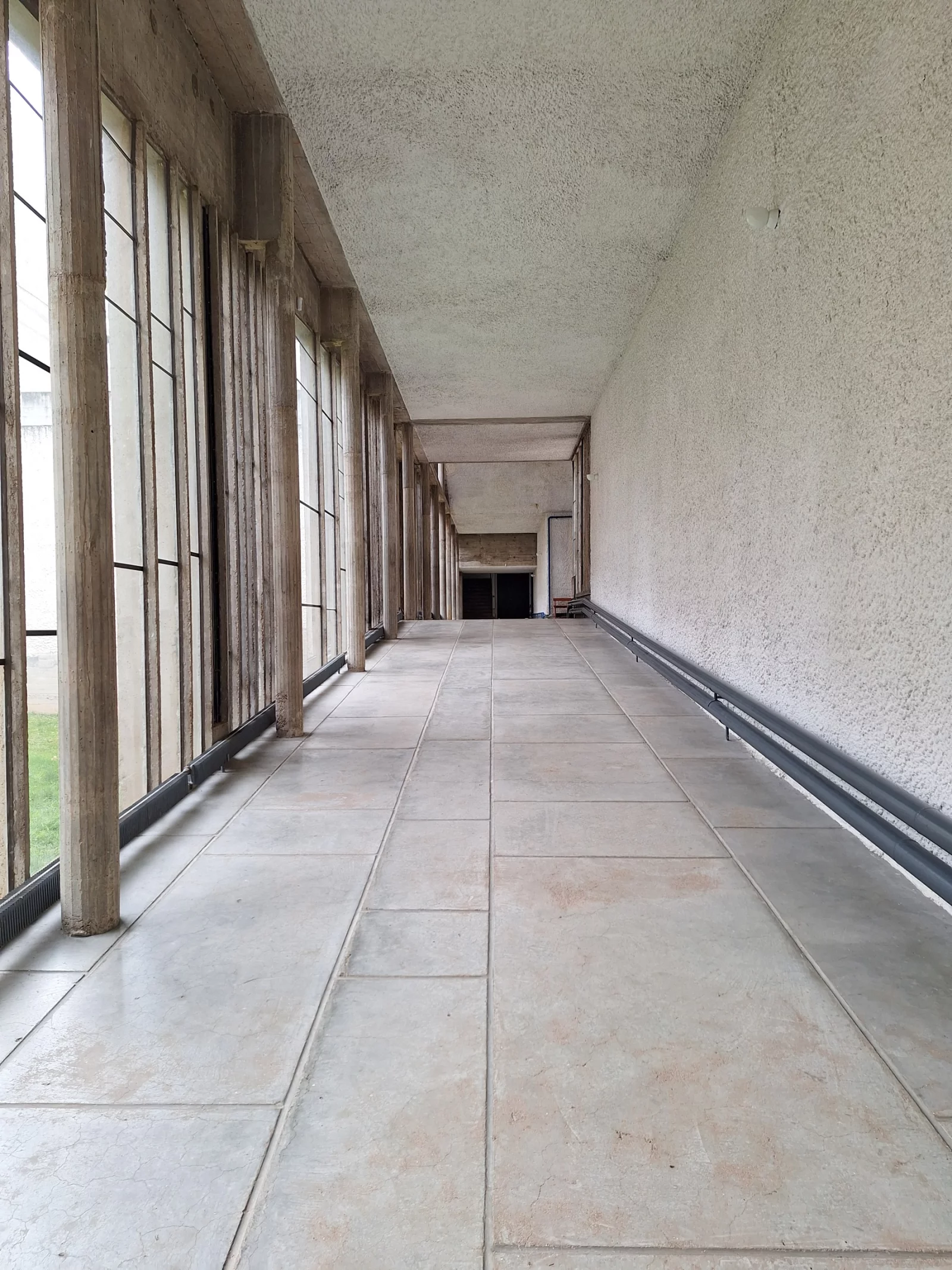 The cloister corridor, glazed to full height