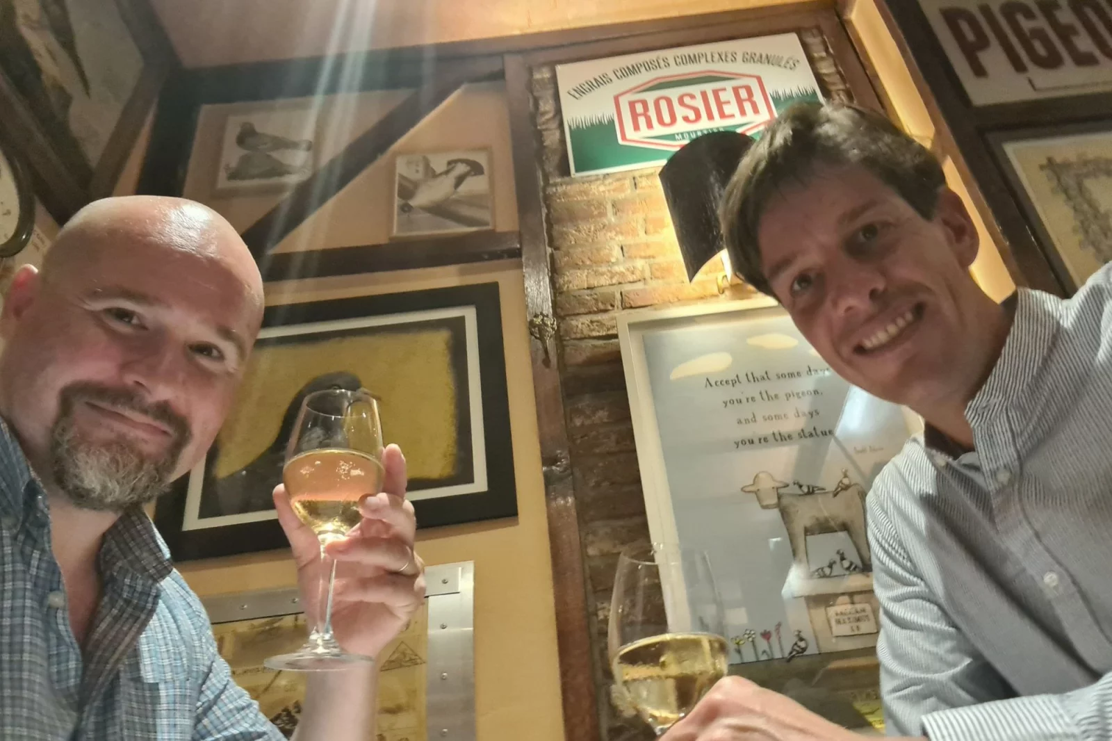 Joost Simons and Yann at a bar, glass in hand