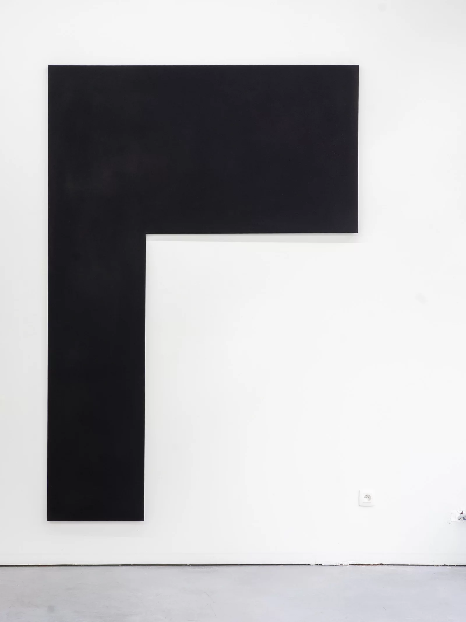 Black L-shape on a white wall